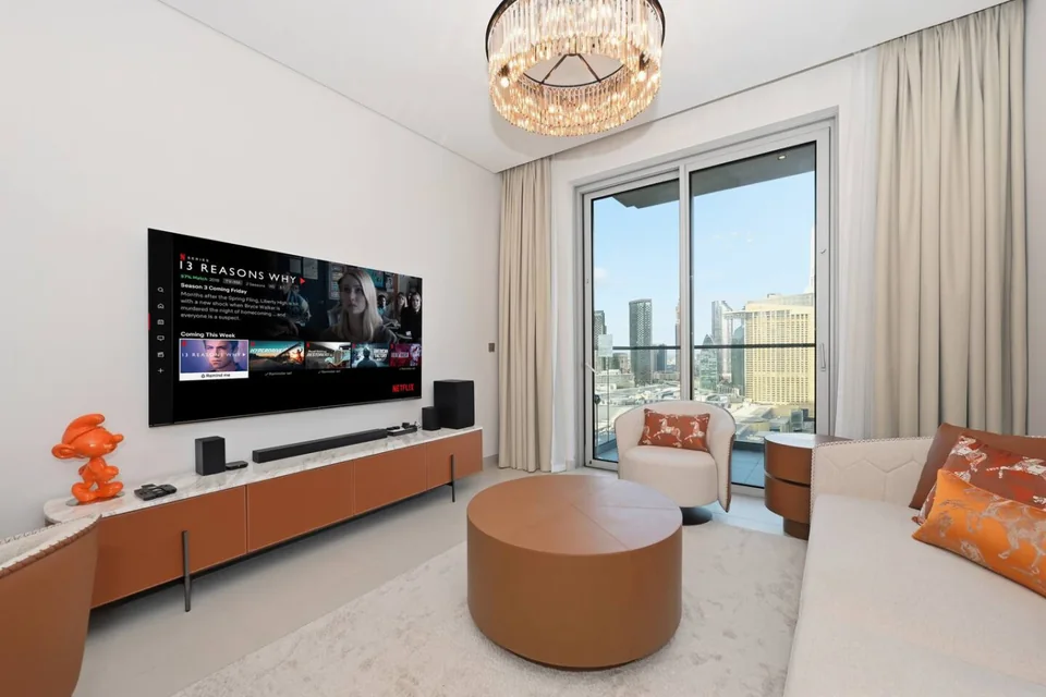 Living room with warm orange accents at Vida Dubai Mall